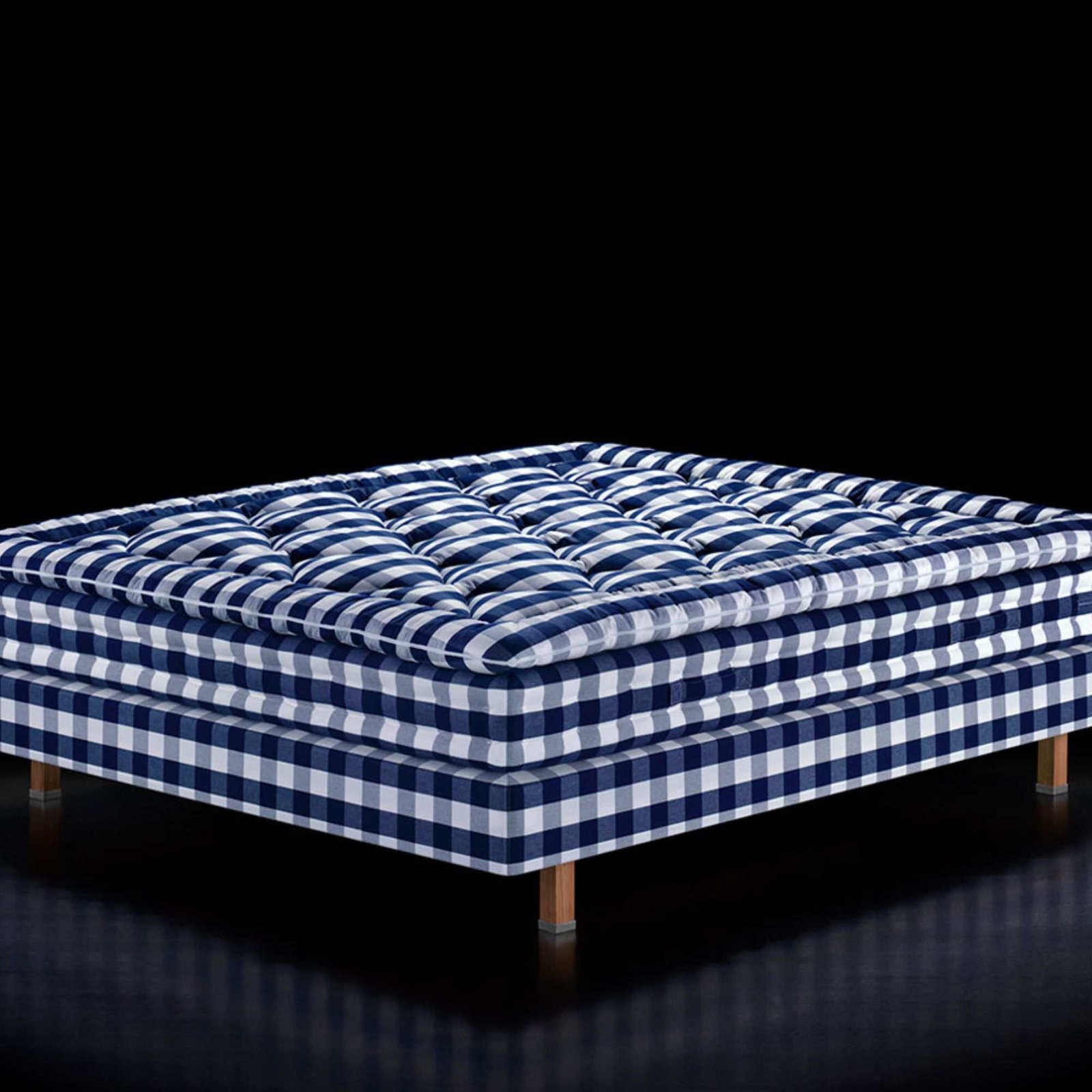 H&amp;auml;stens Maranga Mattress against a black background.